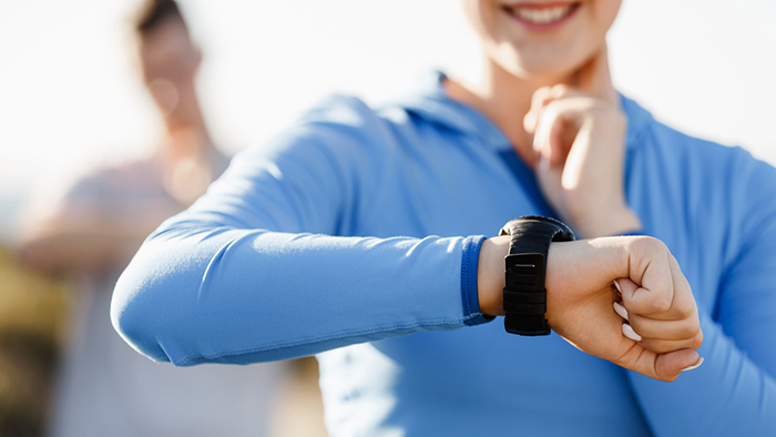Woman looking at her watch